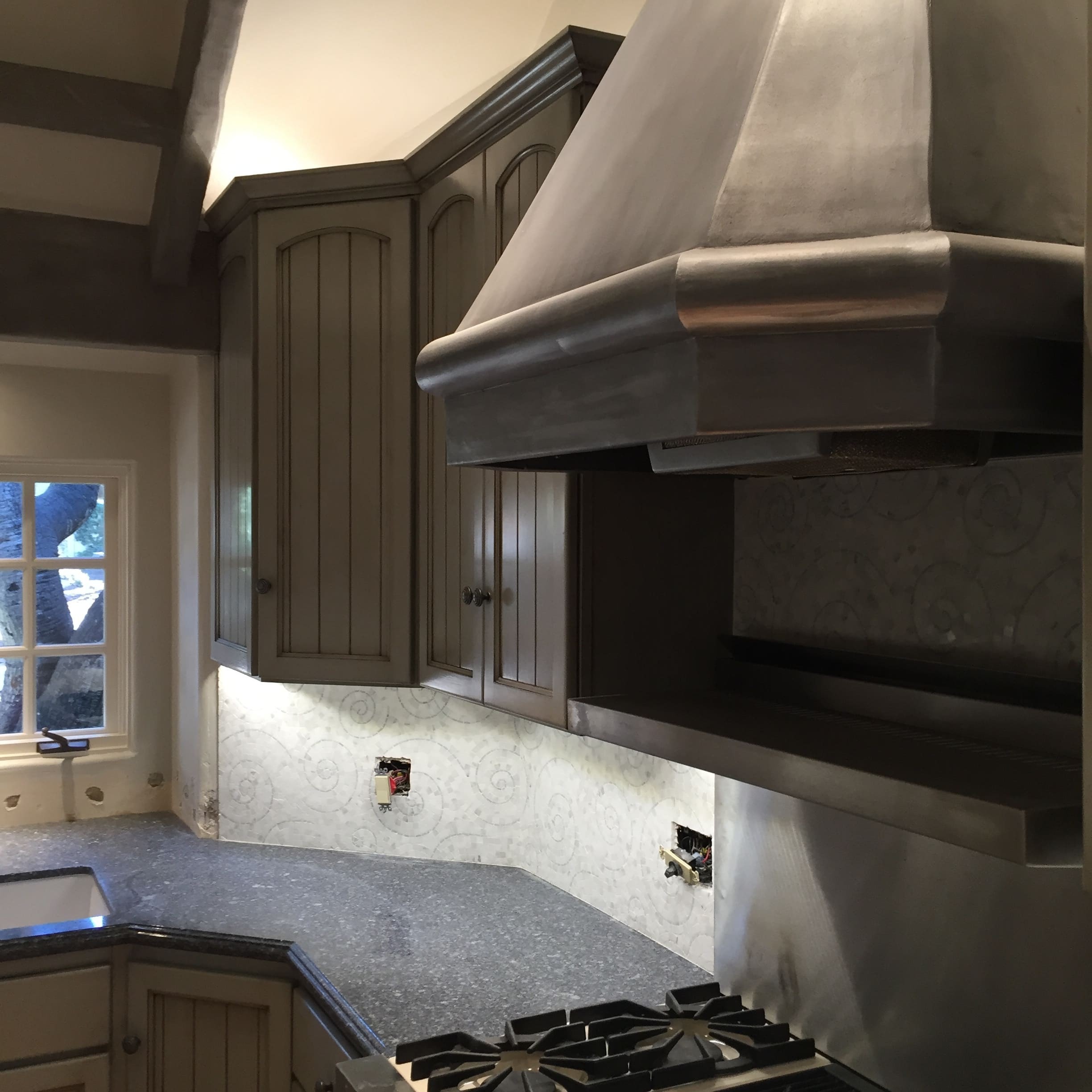 Faux finish treatment on cabinetry and trim